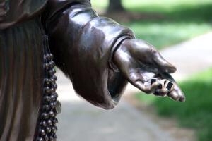 Three rings sit in the palm of the Saint Mary Theodore Guerin's sculpture's hand